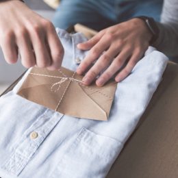 man opening shirt gift