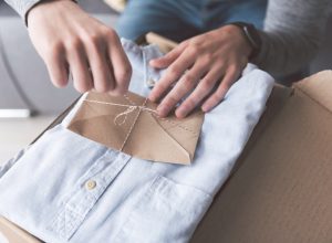 man opening shirt gift