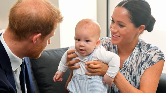 Prince Harry and Meghan Markle holding their son Archie