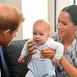 Prince Harry and Meghan Markle holding their son Archie