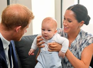 Prince Harry and Meghan Markle holding their son Archie