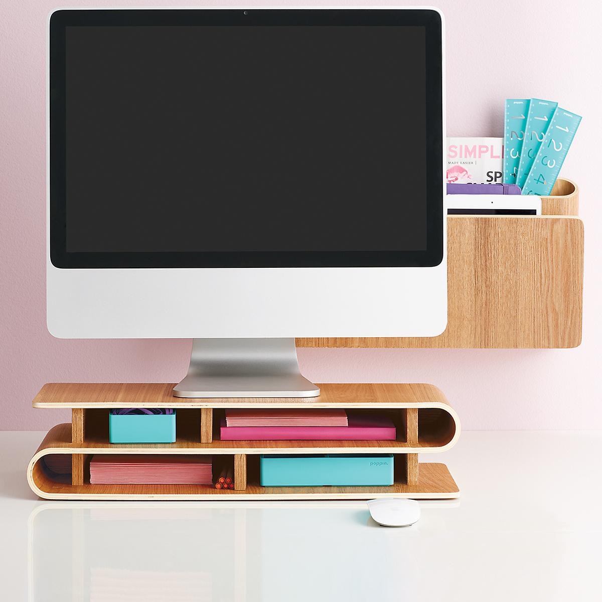 computer on wooden monitor stand