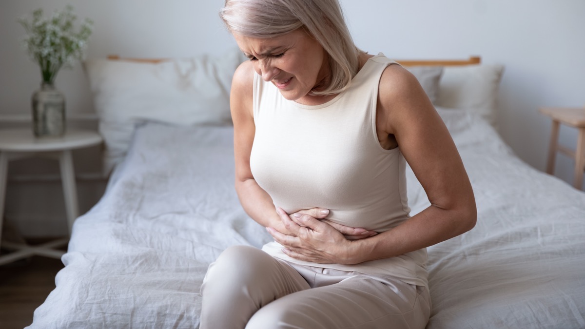 Woman with nausea upset stomach