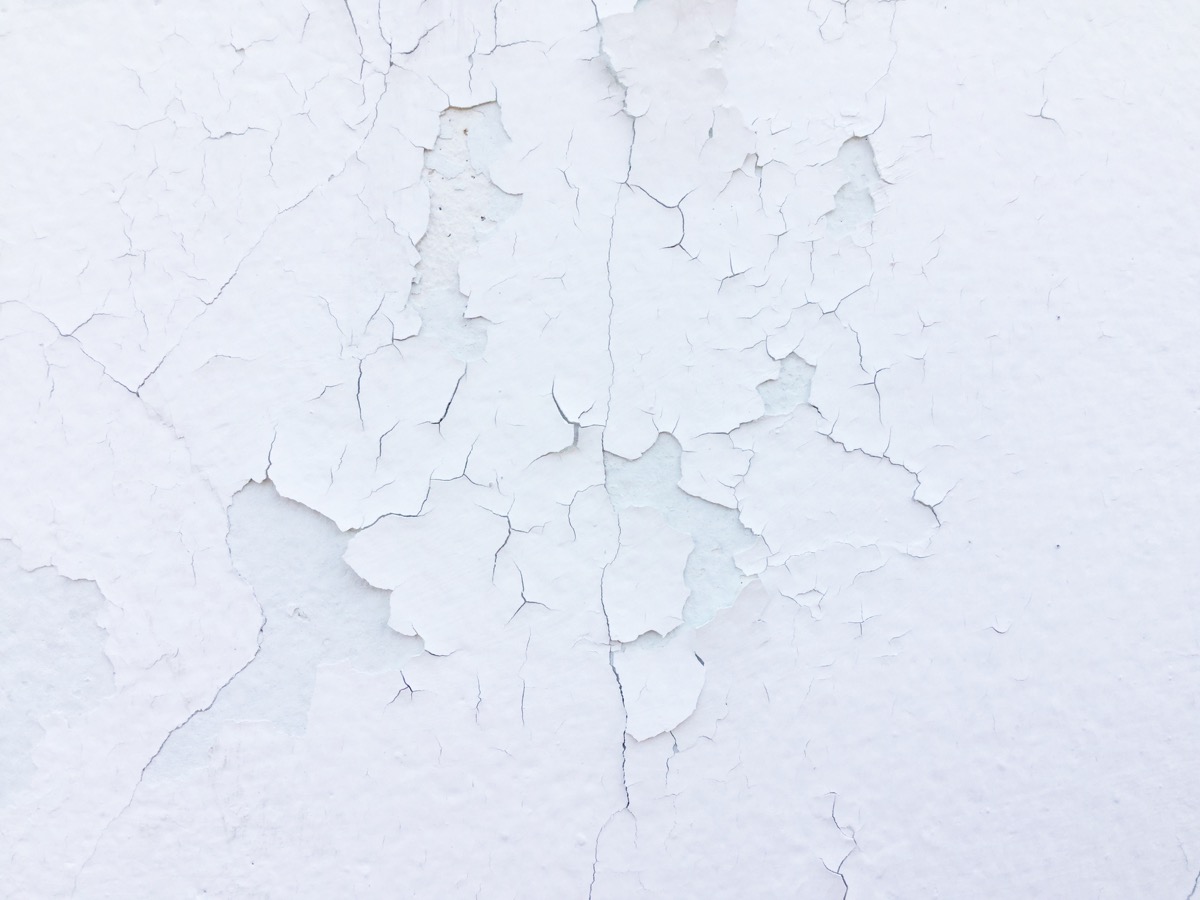 peeling white paint on wall