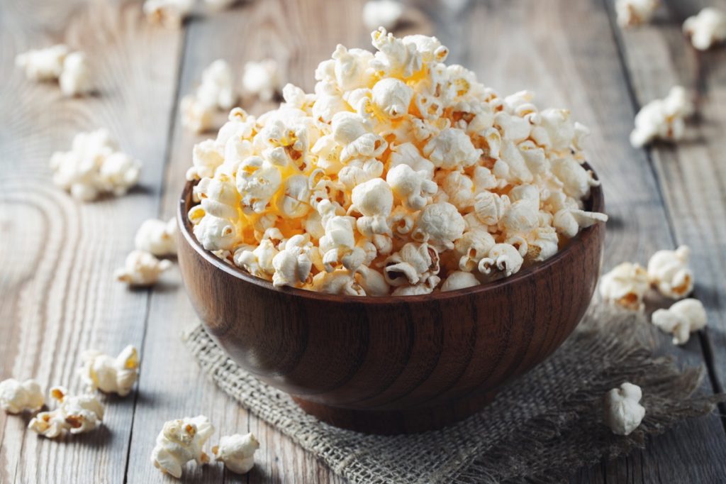 wooden bowl full of popcorn
