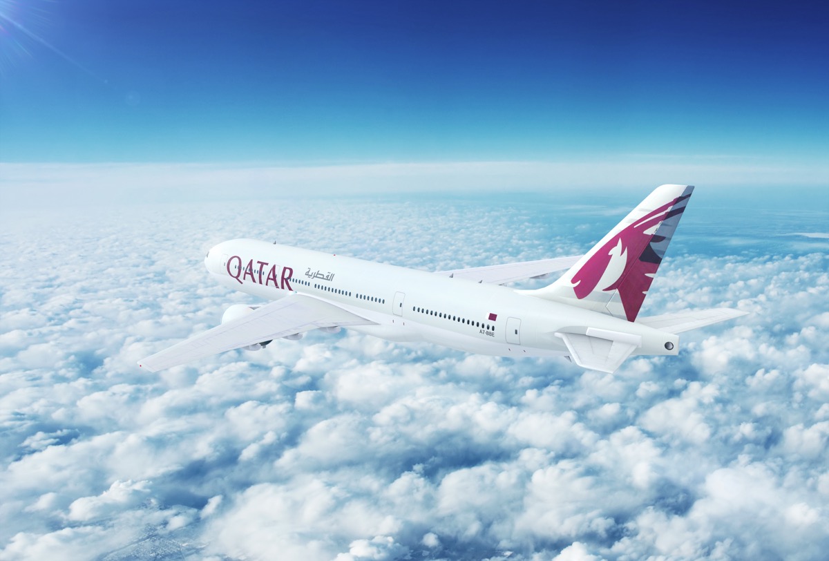 qatar airlines plane above the clouds