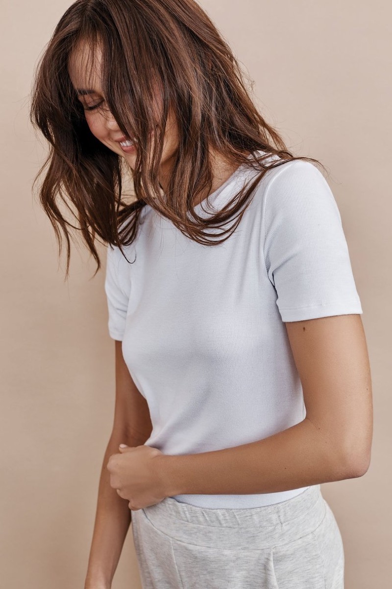 young white woman in white t-shirt
