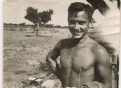 1940s black and white photo of shirtless man