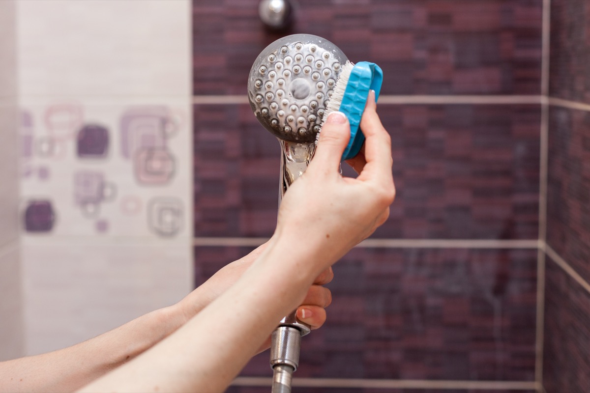 Cleaning shower head with sponge