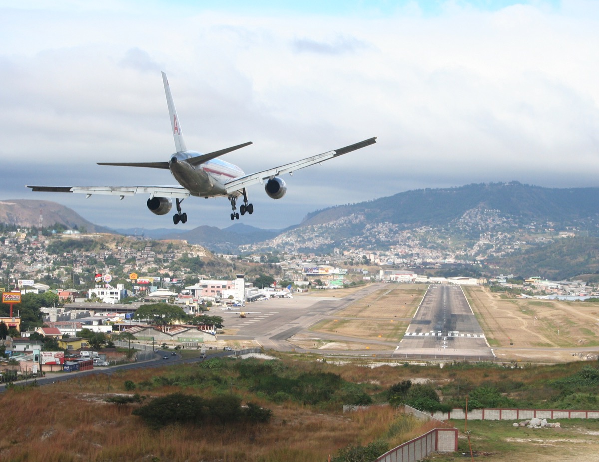 toncontin airport from a bird-eye view with a plane about to land