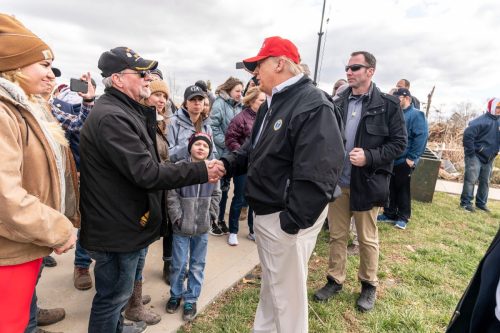 President Donald Trump meets with residents as he surveys the damage to a tornado ravaged neighborhood March 6, 2020 in Cookeville, Tennessee