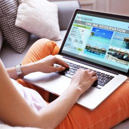 woman making hotel reservation online