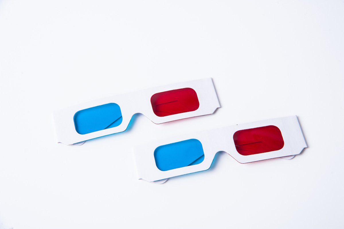 two pairs of old-fashioned 3d glasses on white background