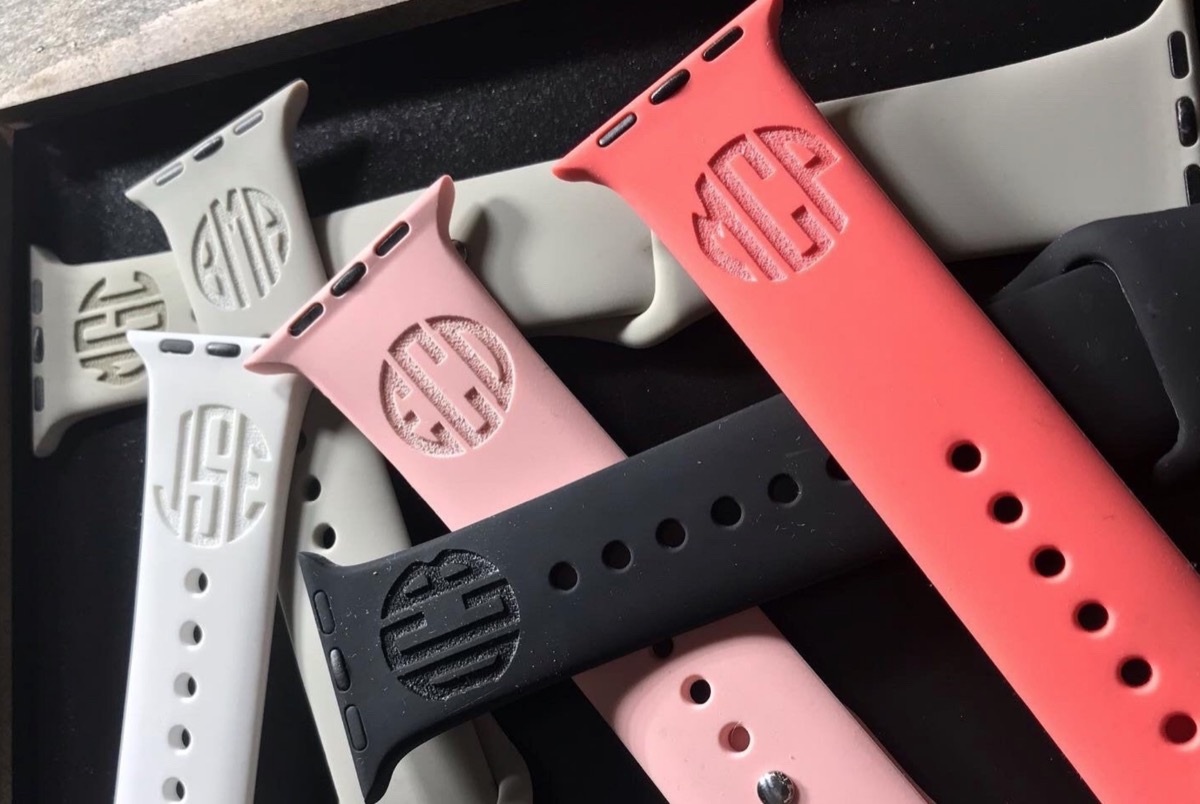 stack of silicone apple watch bands with engraved initials