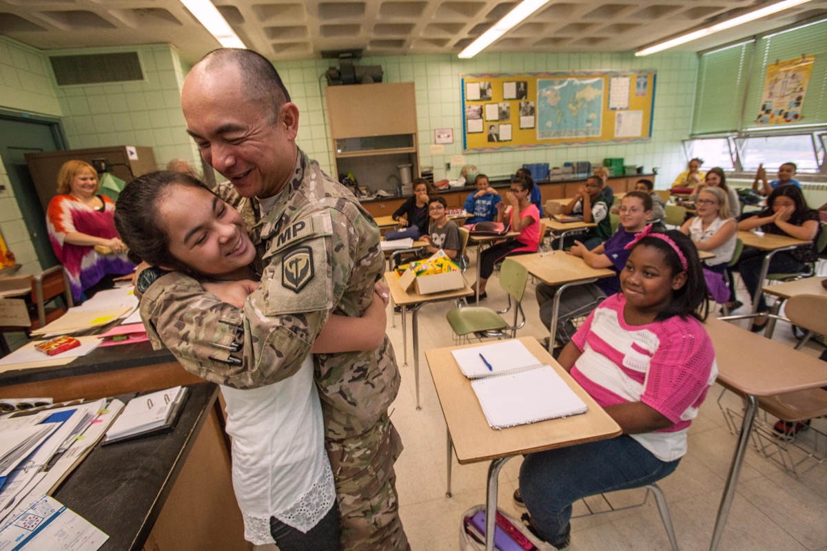HF1ARY Recently returned 1st Sgt. Joseph P.C. Prieto, 508th Military Police Company, New Jersey Army National Guard, surprised his daughter Allison in her sixth grade class at Sayreville Middle School in Parlin, N.J., June 7, 2013. Prieto returned from a nine-month long deployment along with nearly 140 members of the 508th, June 6. The 508th provided security, force protection and advised the Afghan national police force in the Kabul region during their deployment. (U.S. Air National Guard photo by Master Sgt. Mark C. Olsen/Released) Welcome home Dad 130607-Z-AL508-030