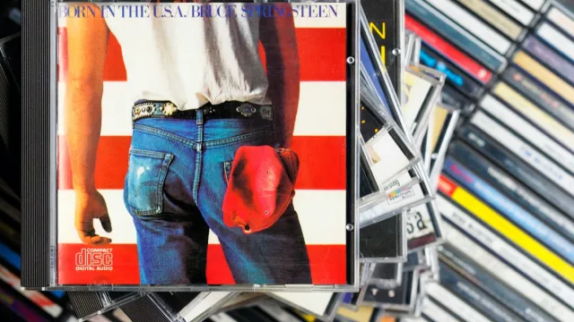 Bruce Springsteen Born in the USA album on a stack of CD cases