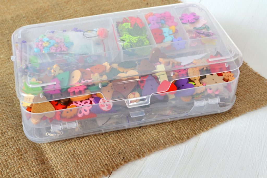 clear plastic storage bin filled with beads