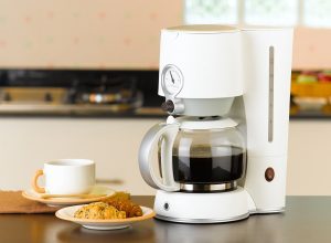 Coffee maker with croissant