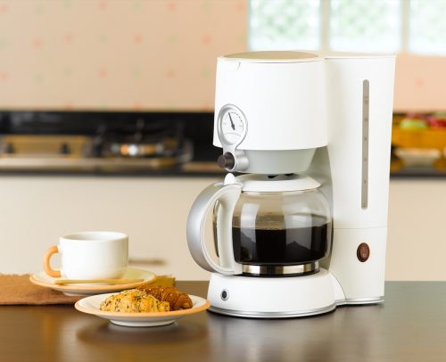 Coffee maker with croissant