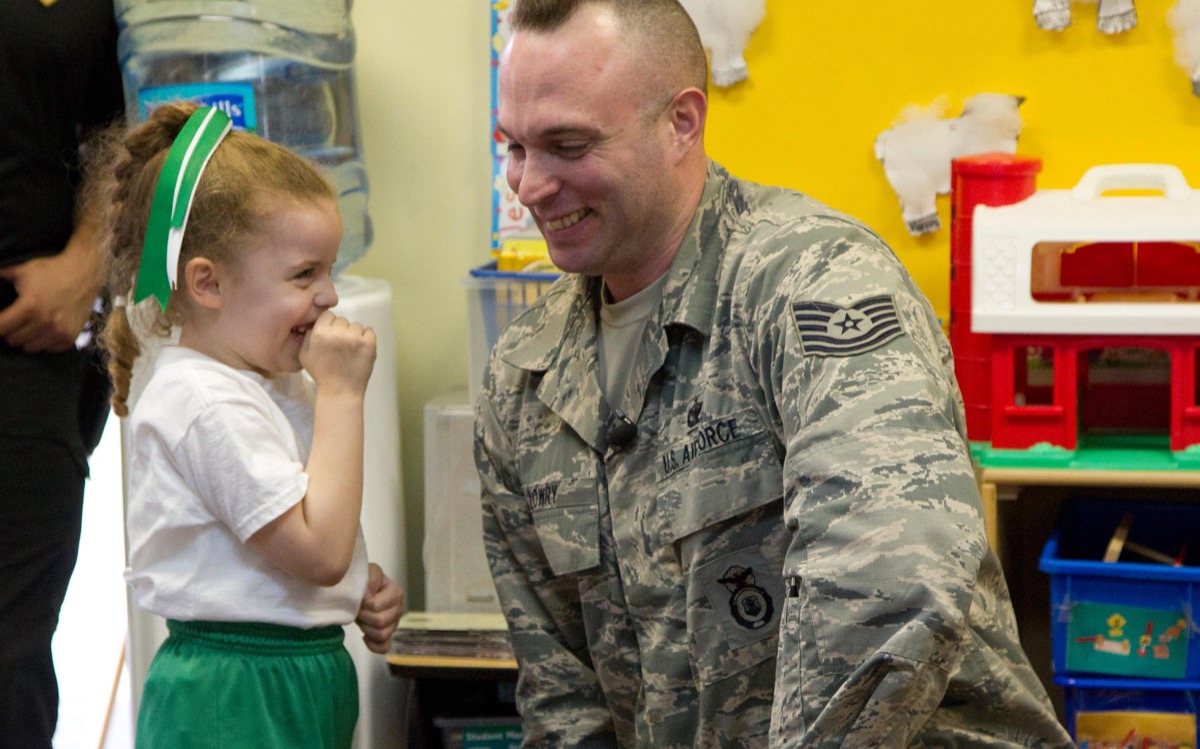 DDP4D1 Sept. 4, 2013 - West Palm Beach, Florida, U.S. - U.S. Airforce Reserves Technical Sgt. Ryan Lowry hugs his 4-year-old daughter Kirstyn after surprising her in her classroom at St. Juliana Catholic School today, Sept. 4, 2013. Lowry was deployed to Central Asia and has been away for more than half a year. (Credit Image: © Taylor Jones/The Palm Beach Post/ZUMAPRESS.com)