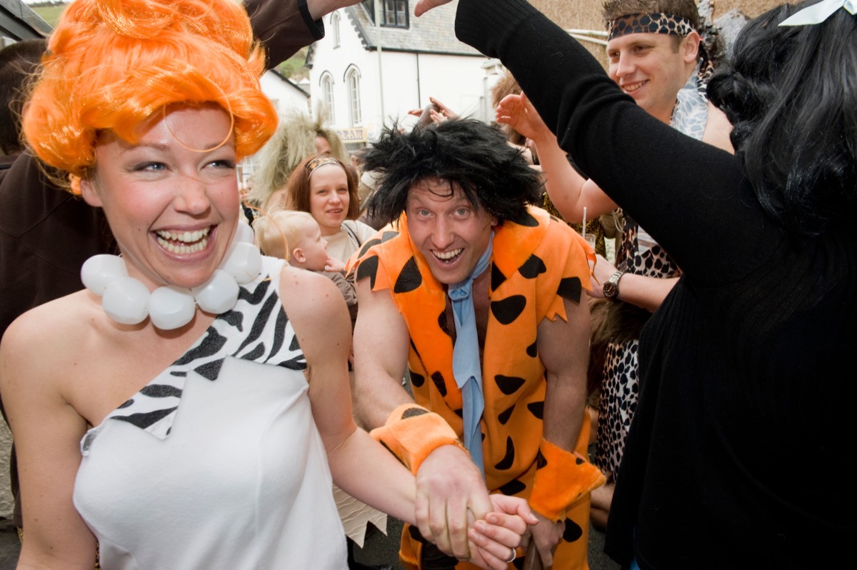 C2H0TT Ed Robinson (34) (Fred)and Gayle Watson (29) (Thelma) at their flintstones themed wedding in Combe Martin, Devon, UK