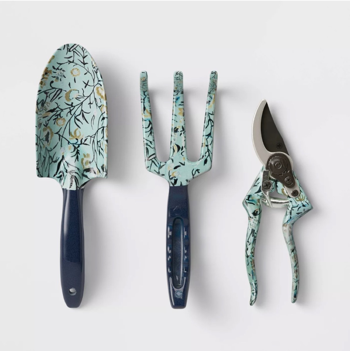 set of three blue gardening tools with a floral print