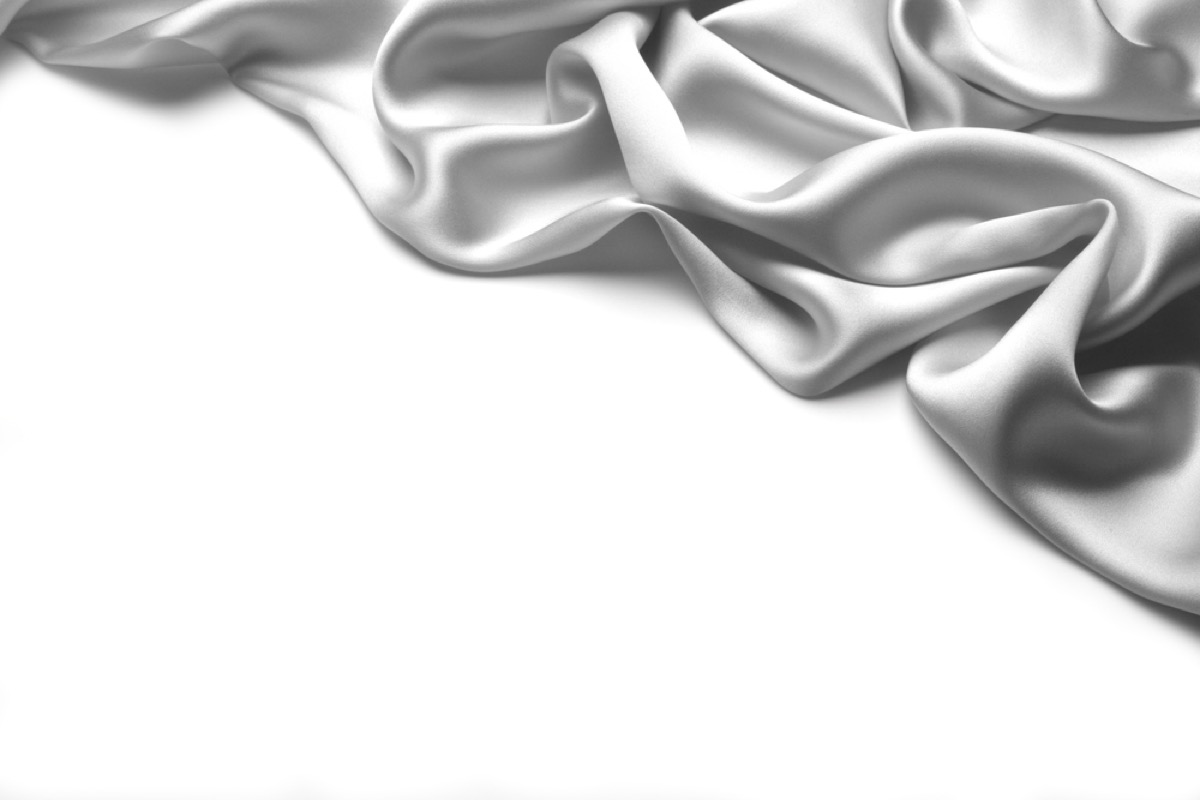 gray silk fabric folded on white background