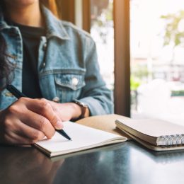 Woman writing in journal