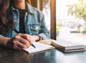 Woman writing in journal