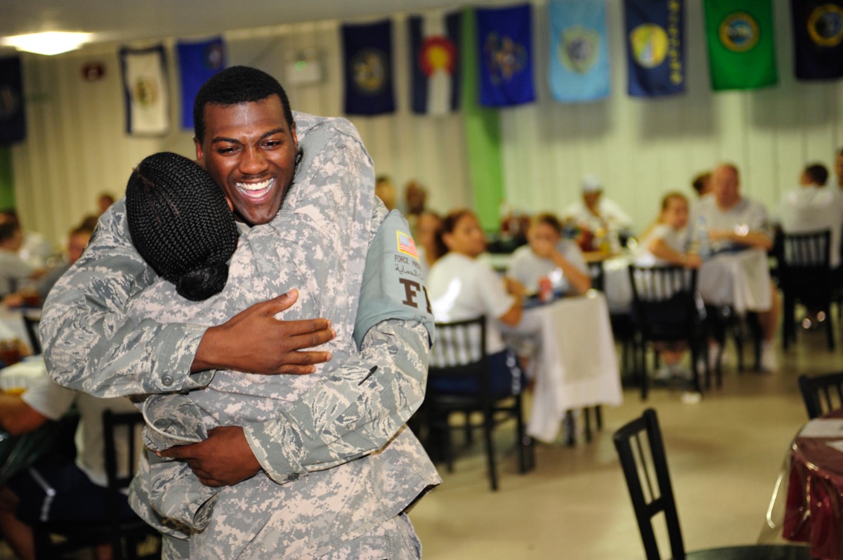 EJKE93 Senior Airman Cody Noble, 380th Expeditionary Security Forces Squadron, hugs his mother, Sgt. 1st Class Karen Hickman, U.S. Army, Aug. 30, 2009. Noble had not seen his mom in more than a year when she visited the 380th Air Expeditionary Wing on a distinguished visitor tour. Airman Noble is deployed from McConnell Air Force Base, Kan. Hickman is deployed from Camp Robinson, Ark. Mom on a Mission, Mother Visits Deployed Son www.dvidshub.net/?script=news/news_show.php&id=38284