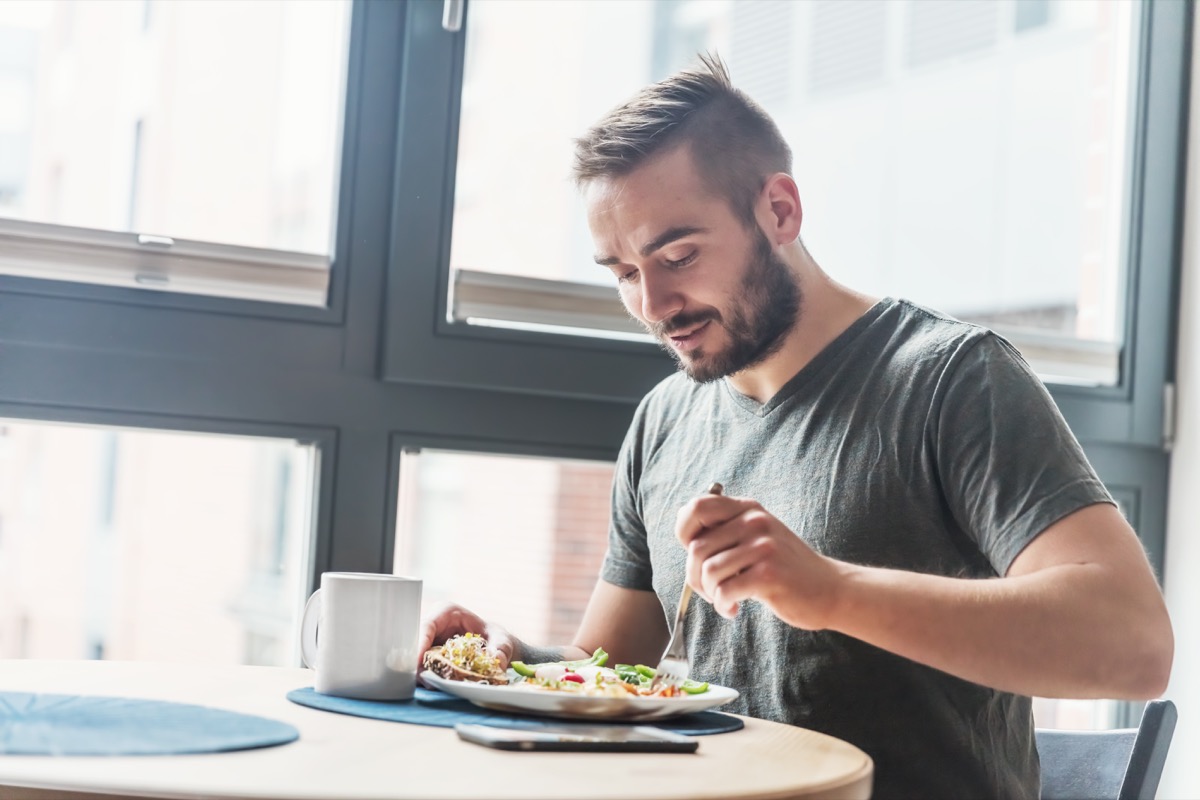A man eating a healthy morning meal, breakfast at home