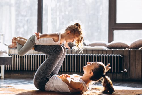 mom and daughter yoga together