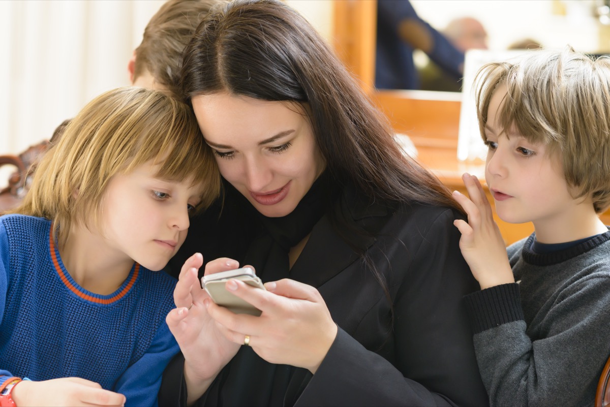 Mother and kids enjoying smartphone