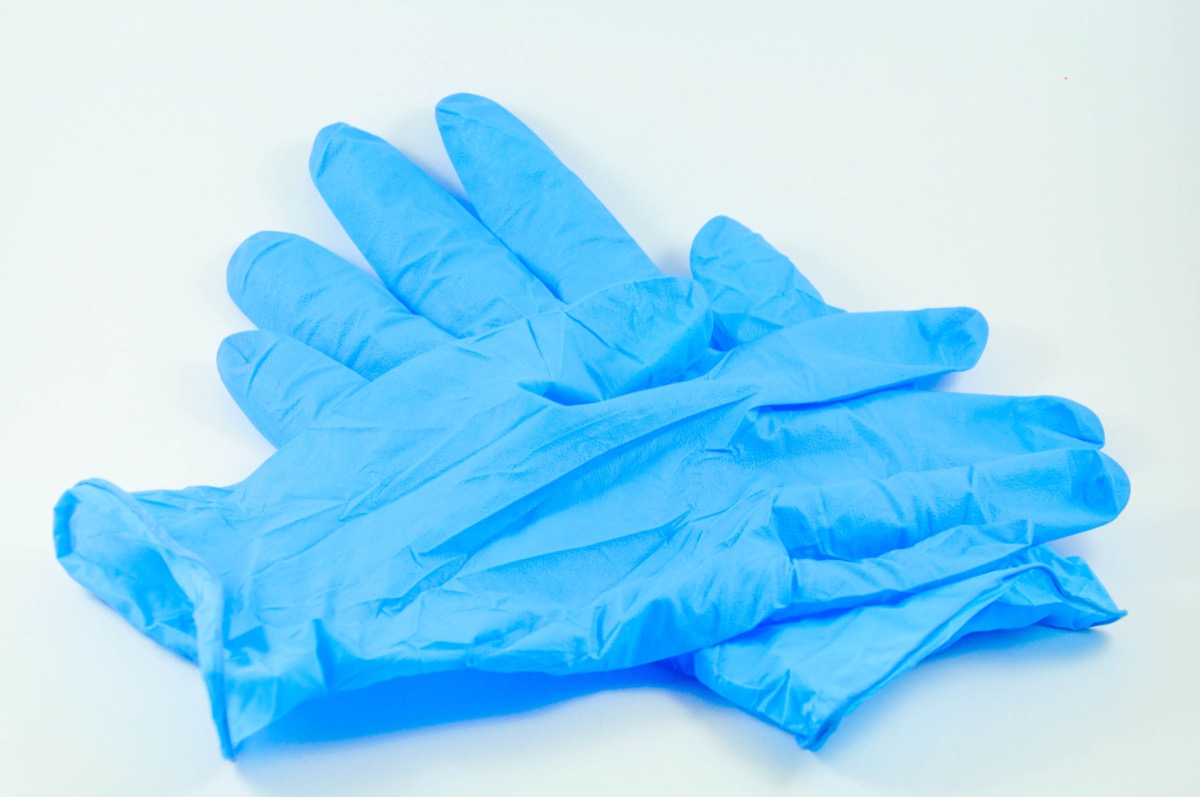 blue nitrile gloves on white background