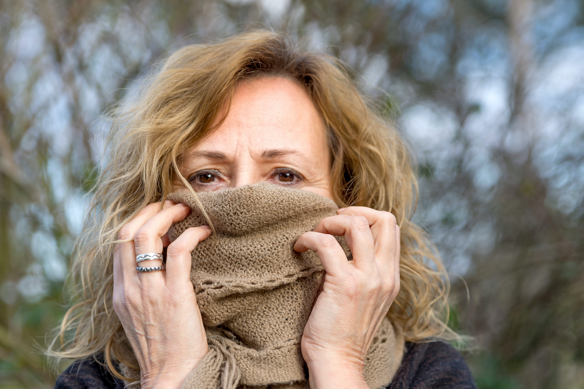 woman with scarf pulled up around her face