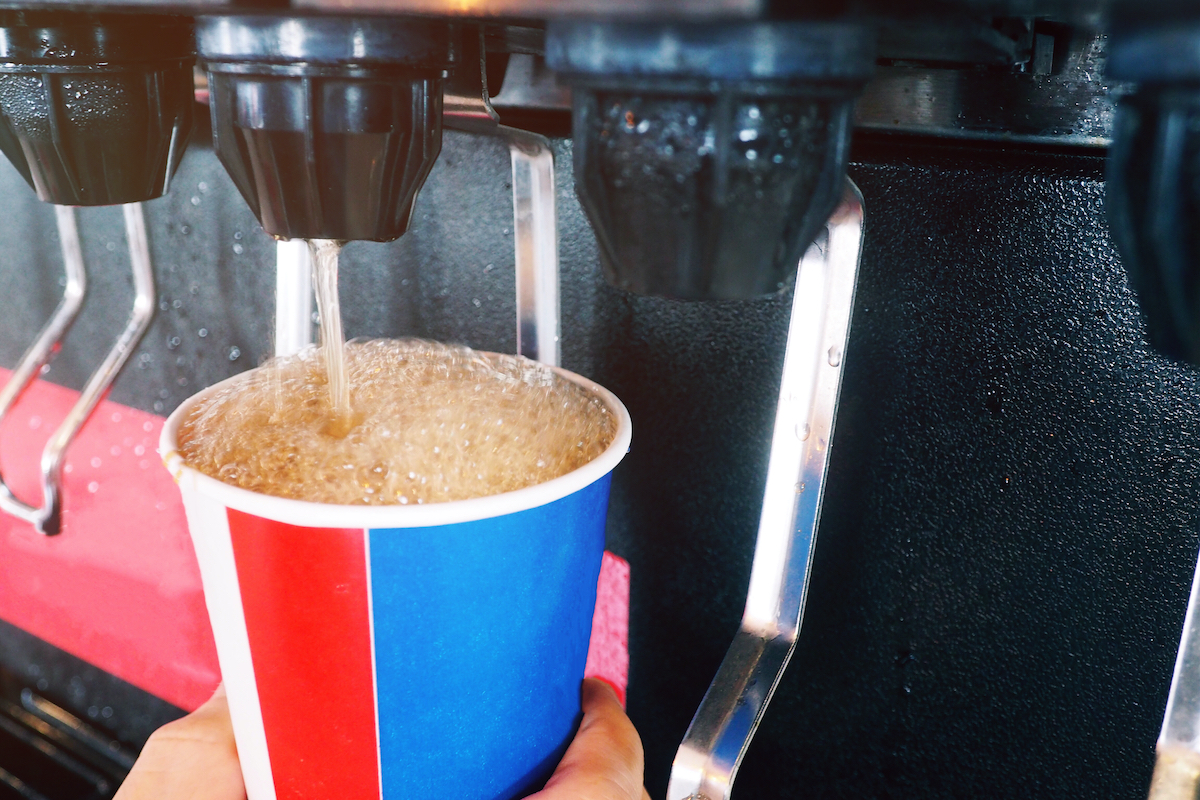 closeup of soda cup at fountain machine