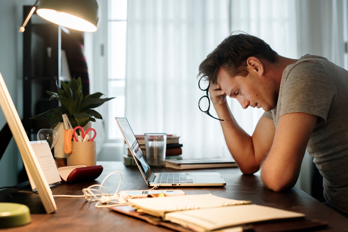 Man stressed working from home