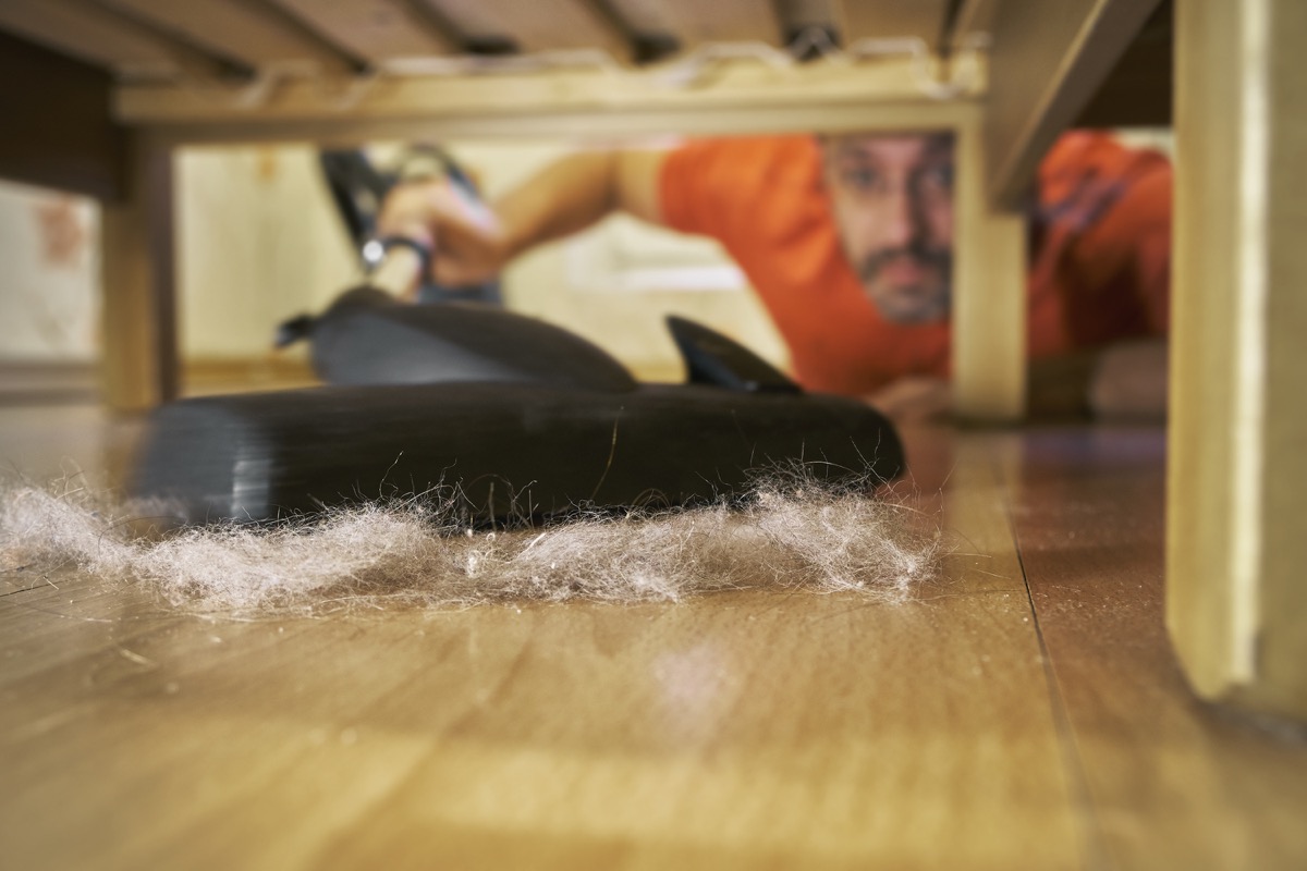 Vacuuming dust under bed