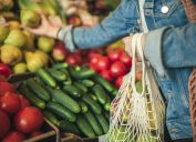 Close-up of ecologically friendly reusable bag with fruit and vegetables while grocery shopping