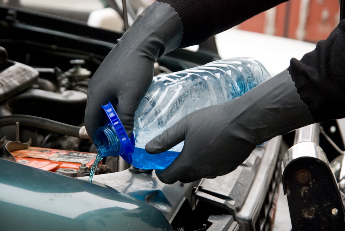 adding fluids to car while wearing gloves