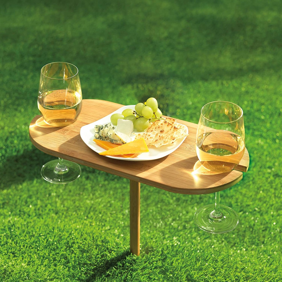 portable wine table with glasses of wine