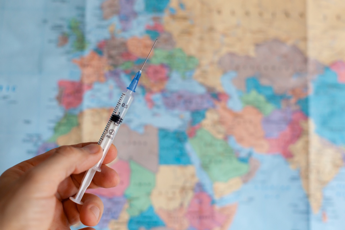 Vaccination in front of map