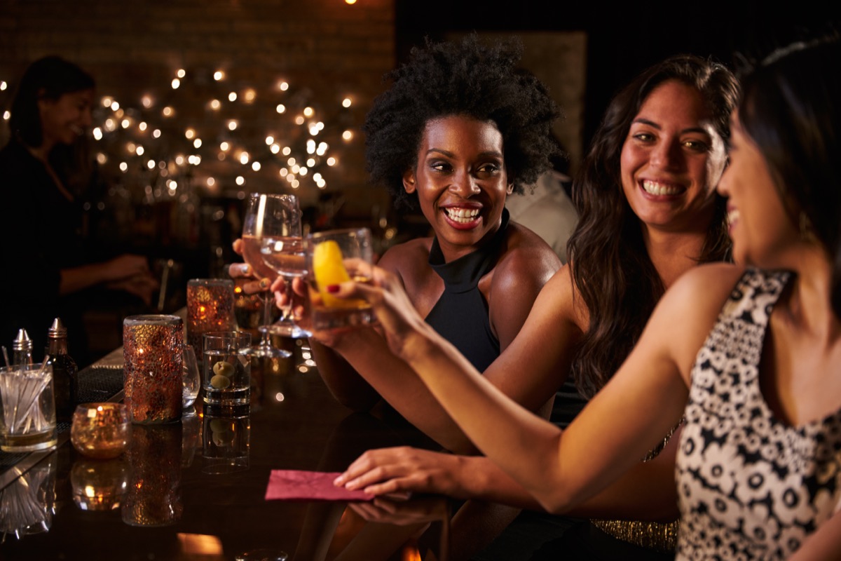 Women getting drinks at a bar together