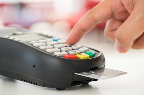 hand using chip credit card reader