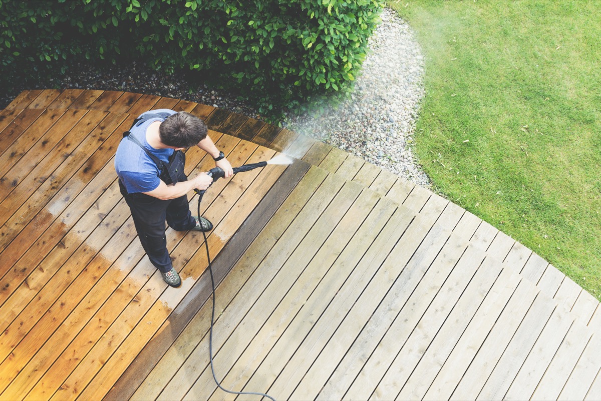 Man cleaning yard and deck