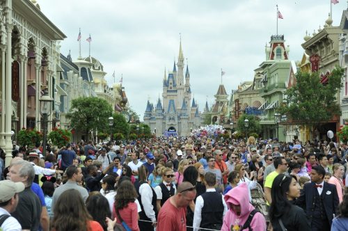 Crowds fill the main avenue leading from Cinderella Castle, Magic Kingdom Park, Walt Disney World
