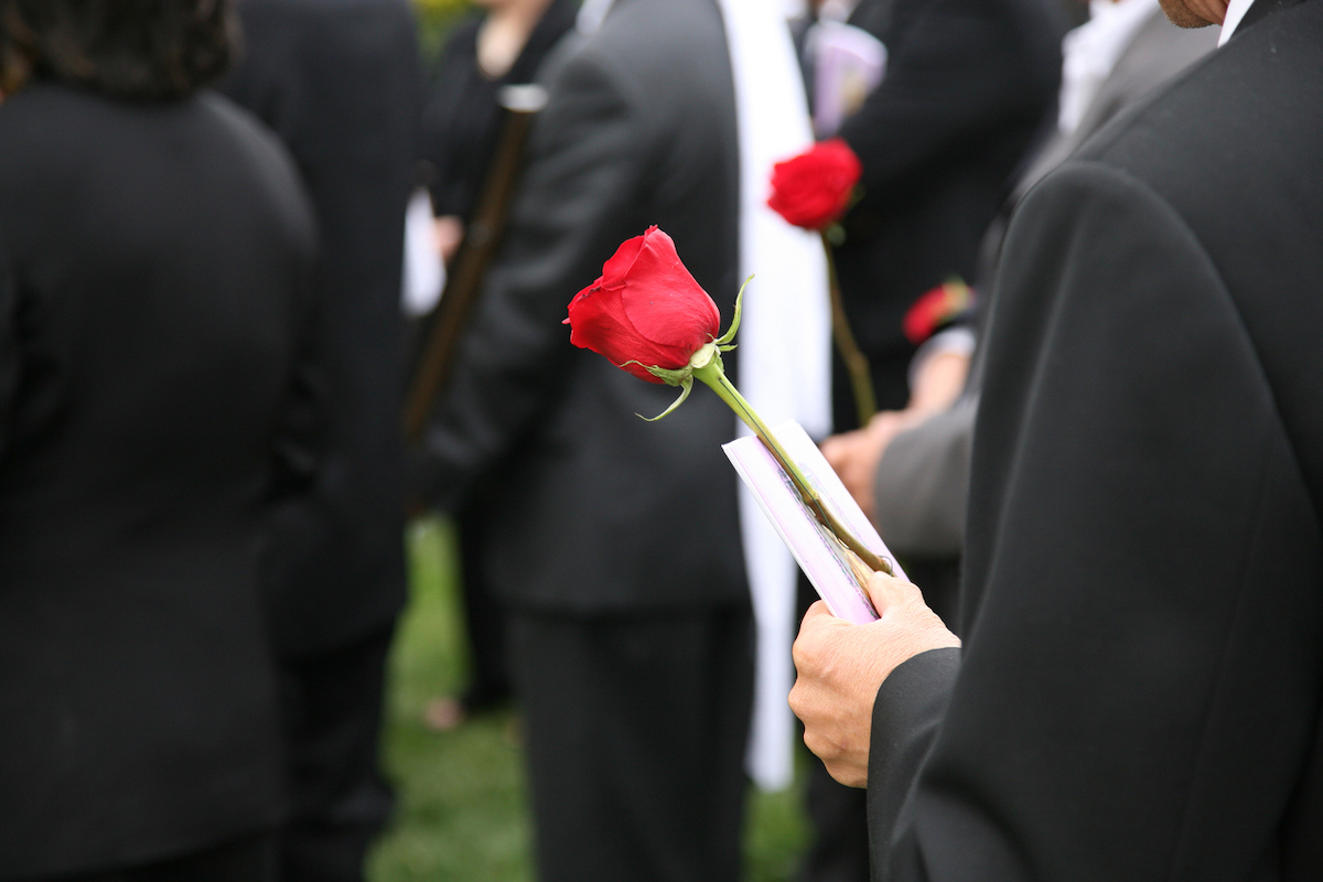 Never Say These 5 Words at a Funeral, Expert Warns — Best Life