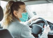Woman during pandemic isolation at city, she is in car