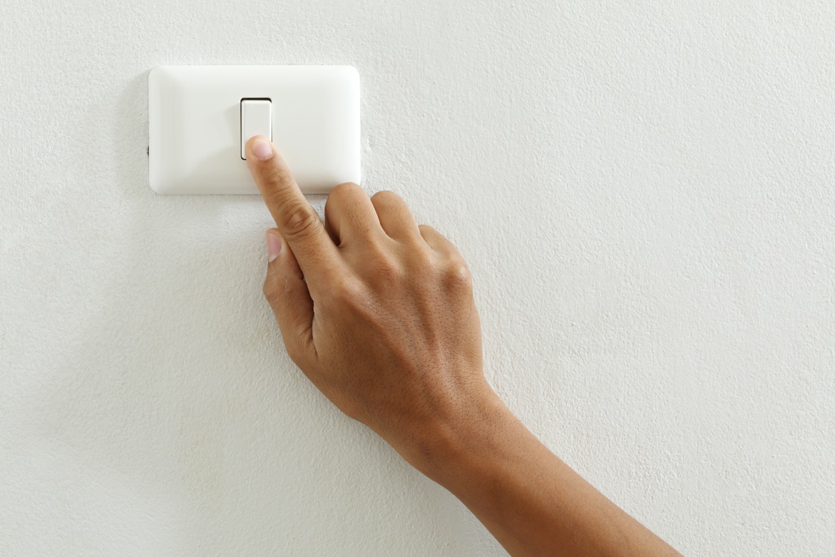 Person touching light switch