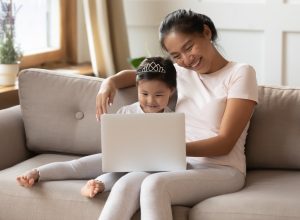 Parent and child on laptop